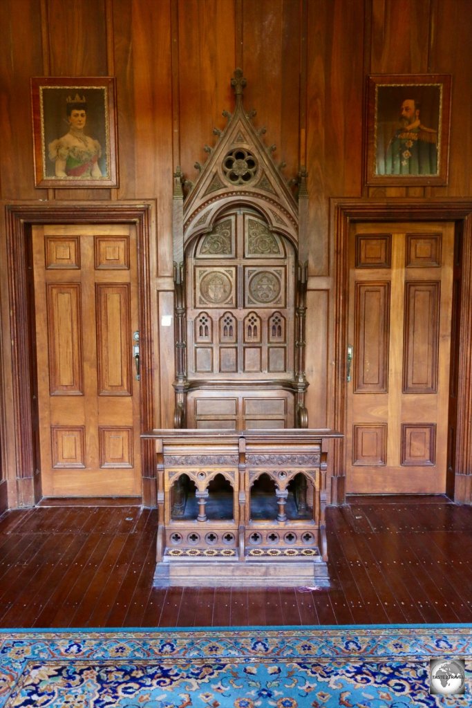 The vestibule of Oceania house features an antique bishop's chair.