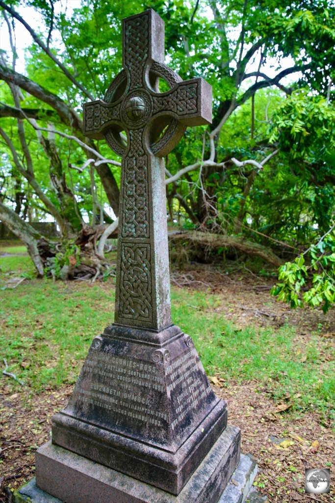 A Celtic cross, in the garden at Oceania House, marks the final resting place of many members of the Clunies-Ross family.