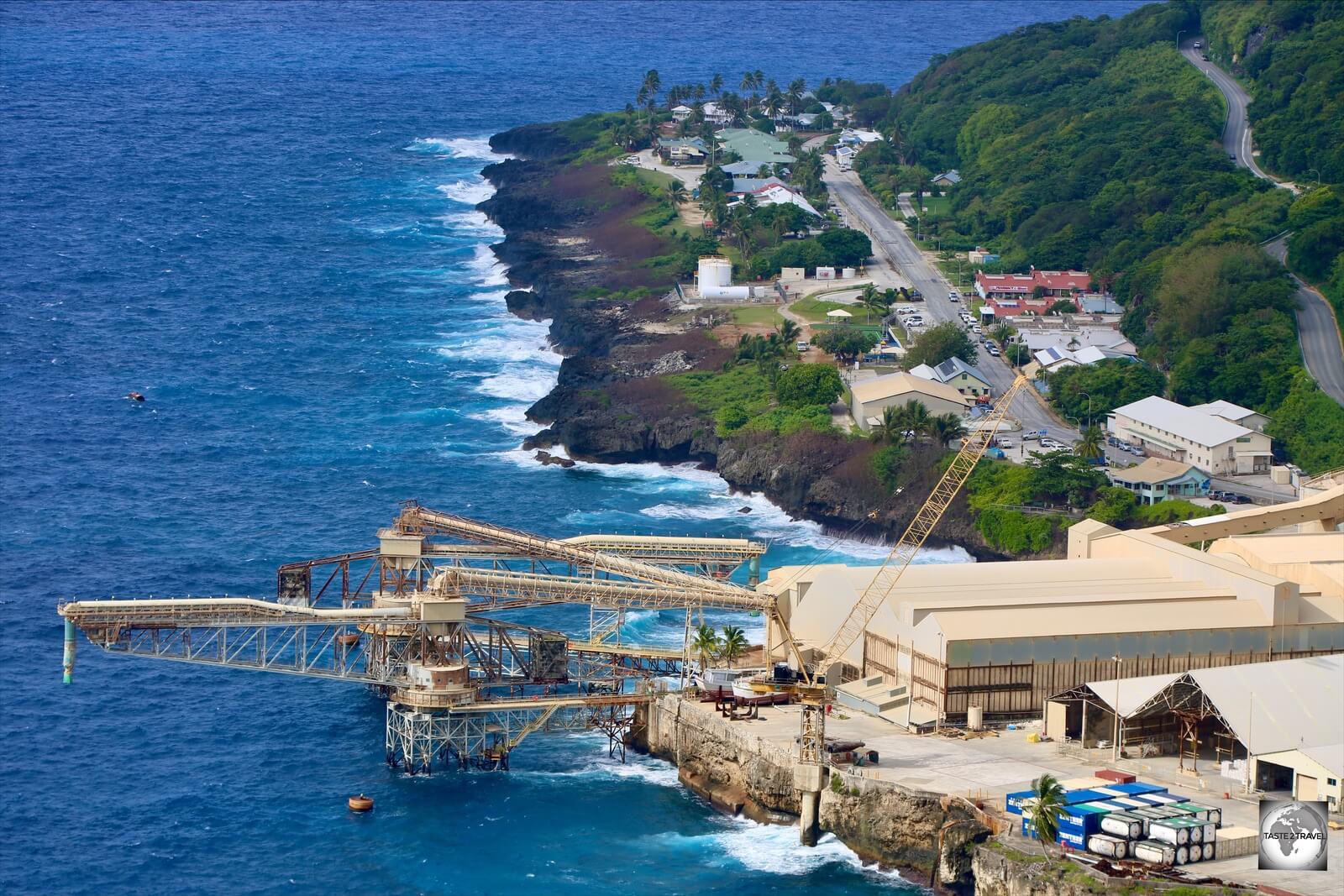 A view of the (beige-coloured) Phosphate storage sheds and the cantilever on Christmas Island.