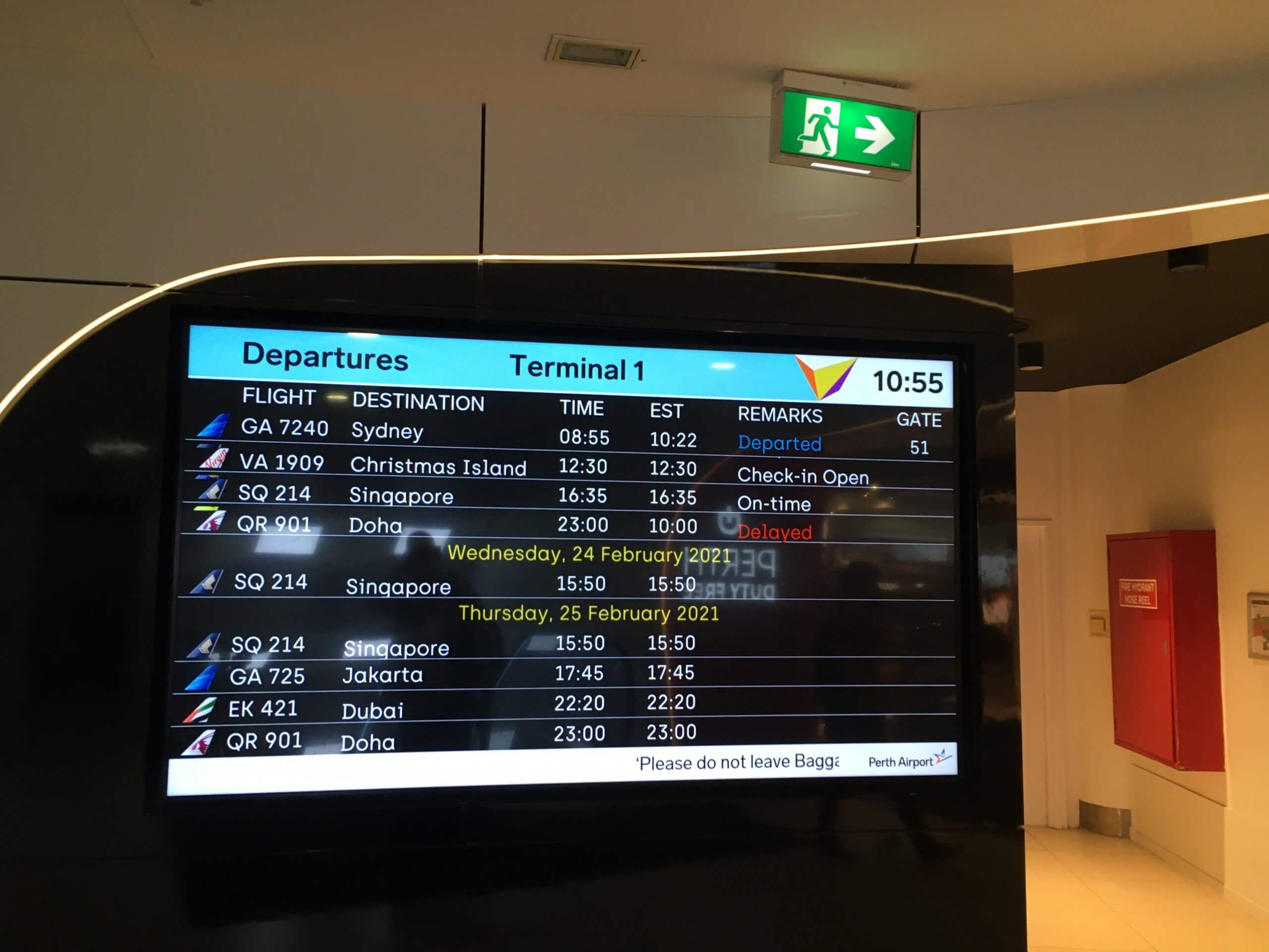 My Christmas Island flight, displayed on the departure board at a very empty Perth International airport.