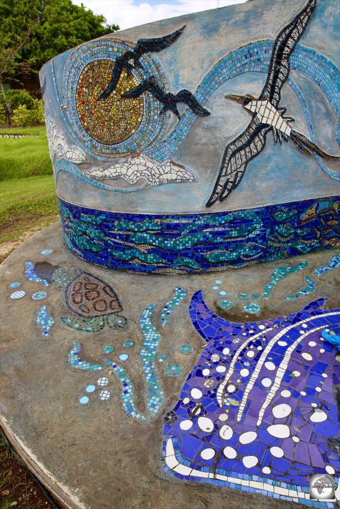 A whale shark, frigatebirds, a booby and more feature on a newly installed, community-made, tile mosaic in the park in The Settlement.