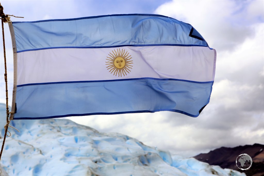 The flag of Argentina flying on the Perito Moreno Glacier.
