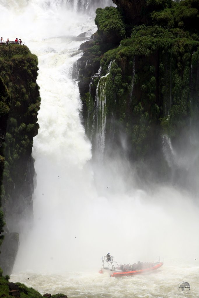 A Brazilian tour boat beneath Devils Throat at Iguazú Falls.