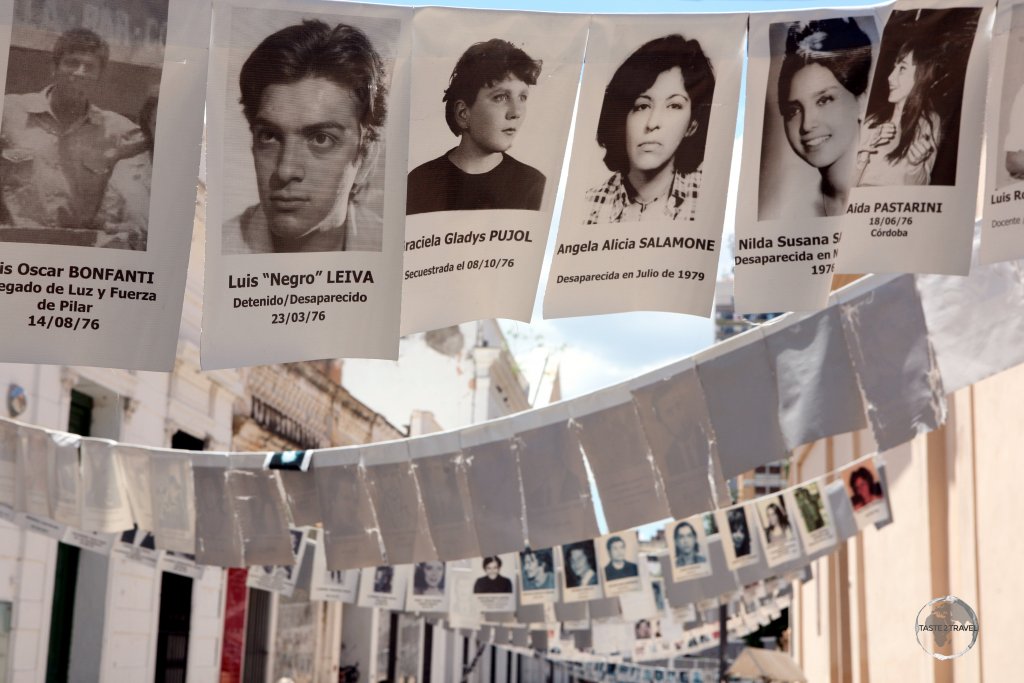 Photographs of disappeared victims of the 1976–83 dictatorship line a laneway in Cordoba. It's estimated that up to 30,000 people were killed during this period.