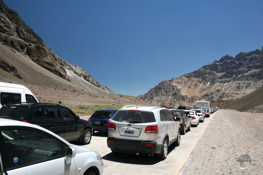 A long line of traffic on the Argentine side of the 'Paso Internacional Los Libertadores', waiting to cross the border into Chile.