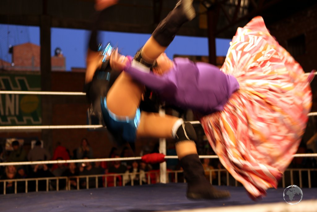 A whirl of colour as the Cholitas grapple, pull braids, give chokeholds, and make some (very theatrical) leaps from the ropes.