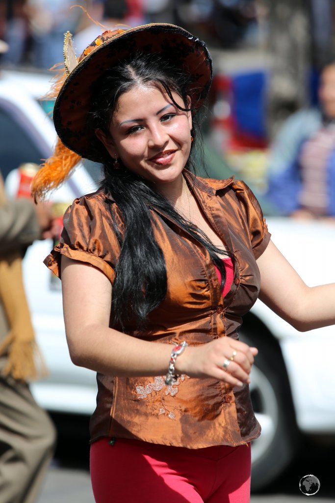 While older participants in the 'Fiesta de la Virgen de Guadalupe' wear traditional costumes, younger dancers wear more modern attire.
