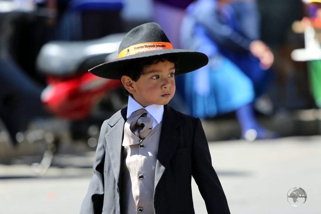 Men (and boys) who participate in the 'Fiesta de la Virgen de Guadalupe' wear formal attire such as hats, suits, tuxedos, ties, leather shoes etc.