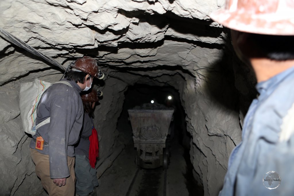 Making way for a loaded ore wagon which was being pushed through the widest passageway in the mine.