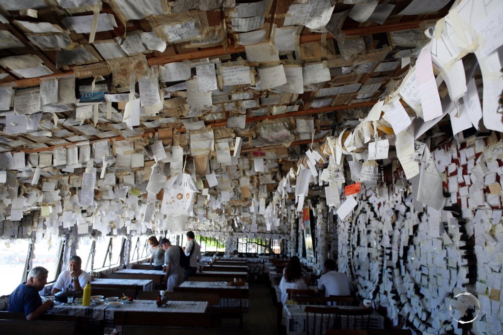 Overlooking Praia do Pântano beach on Florianópolis, Bar do Arante is famous for its seafood and the 1000's of reviews which customers stick to the walls and ceiling.