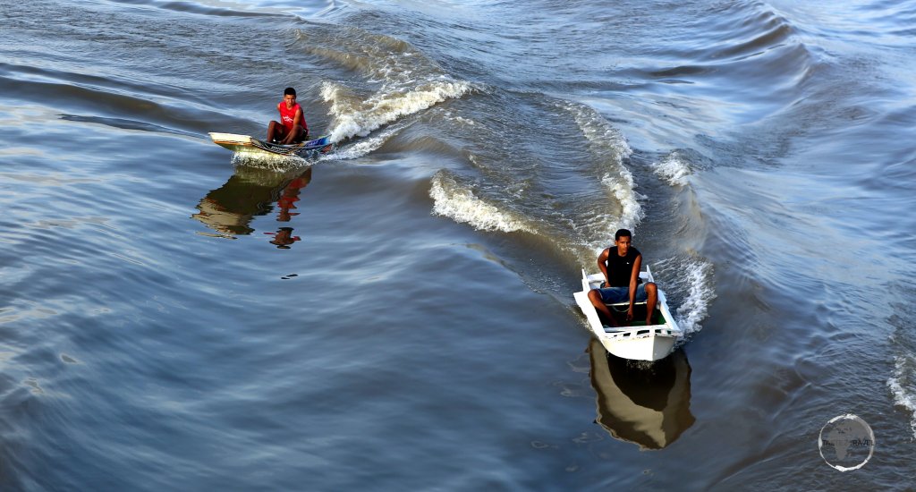 Life on the Amazon river - young villagers speeding alongside our boat in their zippy speedboats.