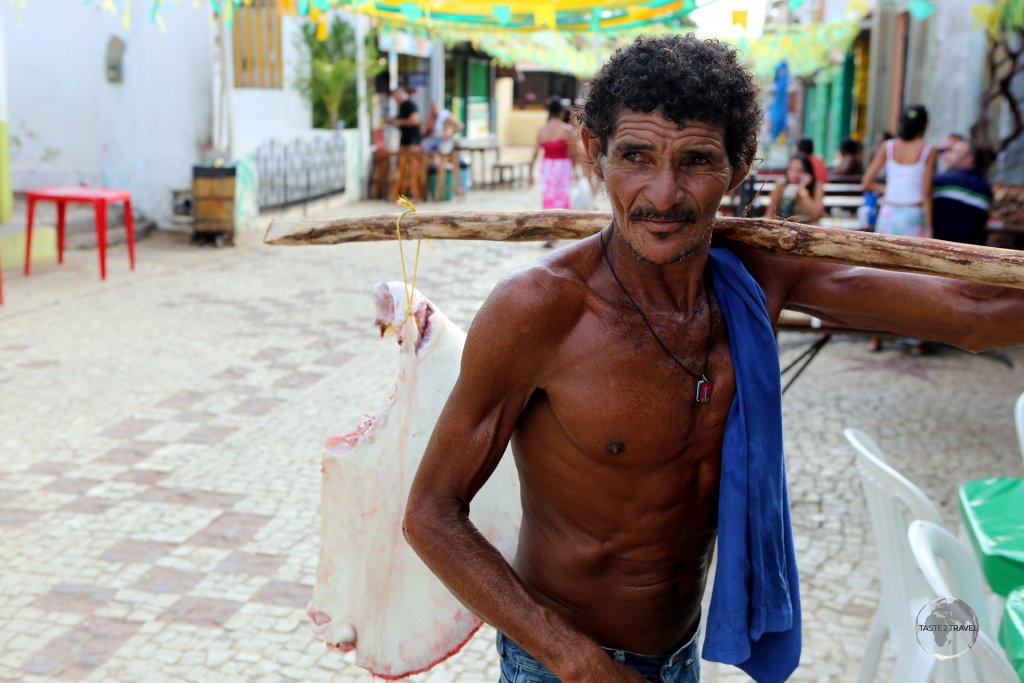 A local fisherman selling part of a stingray in the old town of Canoa Quebrada, Ceará state, Brazil.