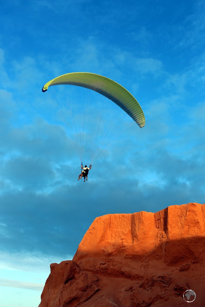 Hand gliding over the ochre cliffs of Canoa Quebrada, (meaning broken canoe in Portuguese), a popular beach resort, located 164 km east of Fortaleza.
