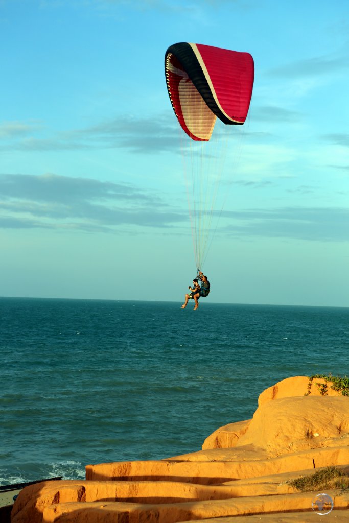 Hand gliding over the beach at Canoa Quebrada, Ceará state, Brazil.