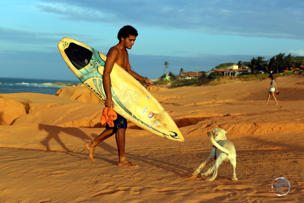 A surfer in Canoa Quebrada, Ceará state, Brazil.