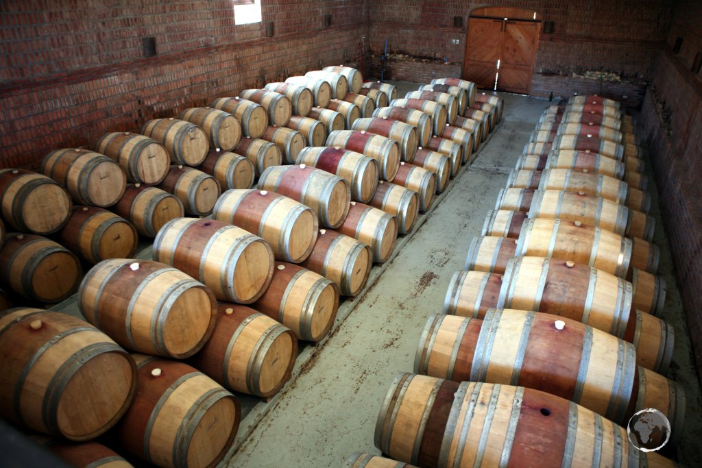 Barrels of Cabernet Sauvignon red wine, maturing at a winery in central Chile.