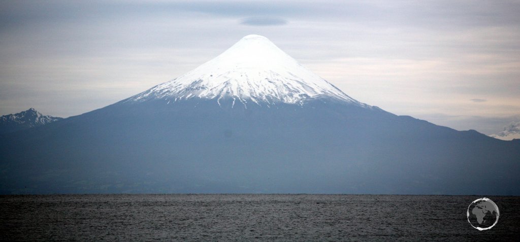 A view of Osorno volcano and Lake Llanquihue from the lakeside town of Puerto Varas, southern Chile.