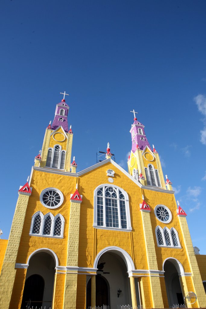 Fronting the Plaza de Armas, the main square of Castro, the capital of Chiloe, the brightly painted 'Iglesia de San Francisco' is listed as a UNESCO World Heritage Site.