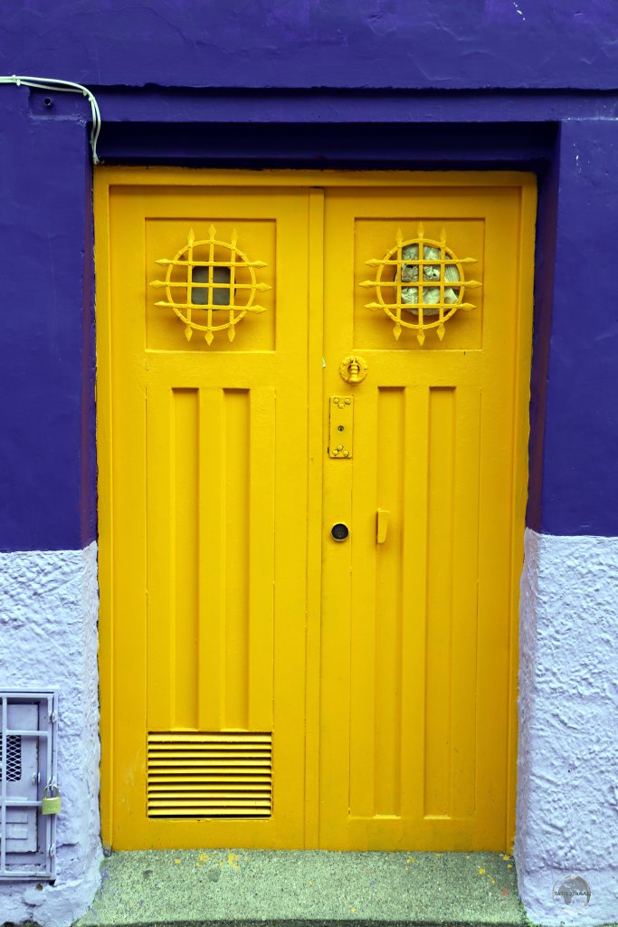 A colourful doorway in the historic 'La Candelaria' district, the vibrant heart of Colombia's capital city.