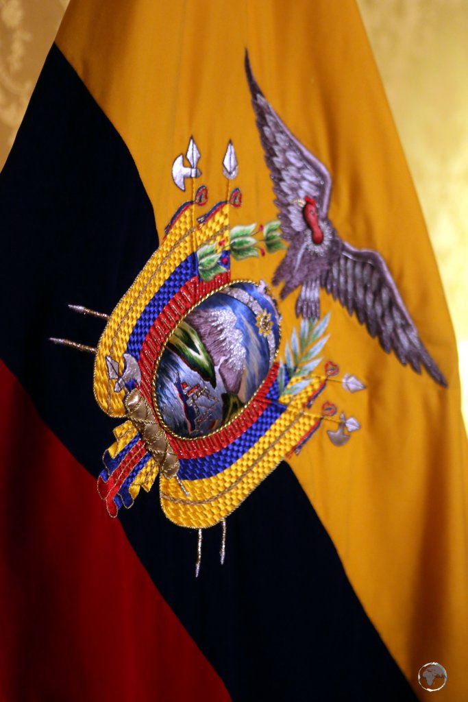 A handwoven coat-of-arms adorns the flag of Ecuador inside Carondelet Palace in Quito.