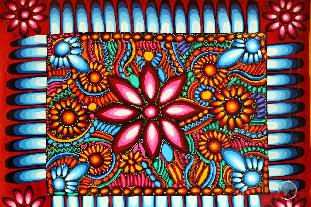 A colourfully painted wooden platter at the Otavalo craft market.
