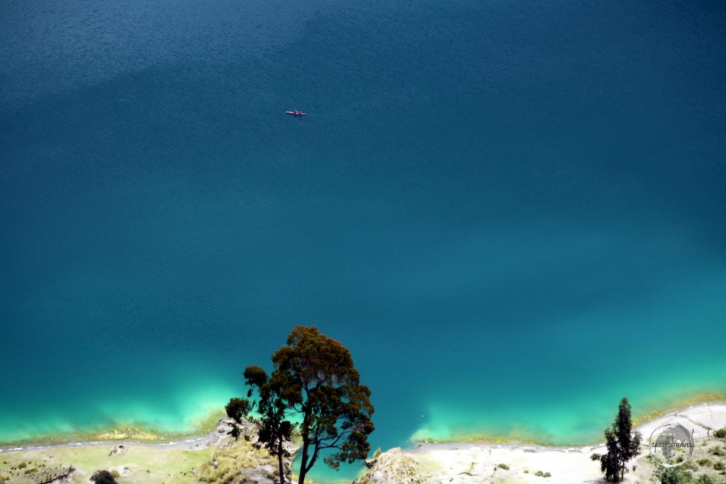 The greenish colour of the water in 'Laguna del Quilitoa' is influenced by dissolved minerals and carbon dioxide gases which are emitted from fumaroles on the floor of the lake.