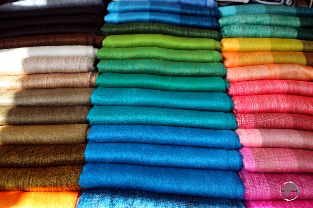 Colourful Andean fabrics are a popular souvenir item at the weekly handicraft market in Otavalo, Ecuador.
