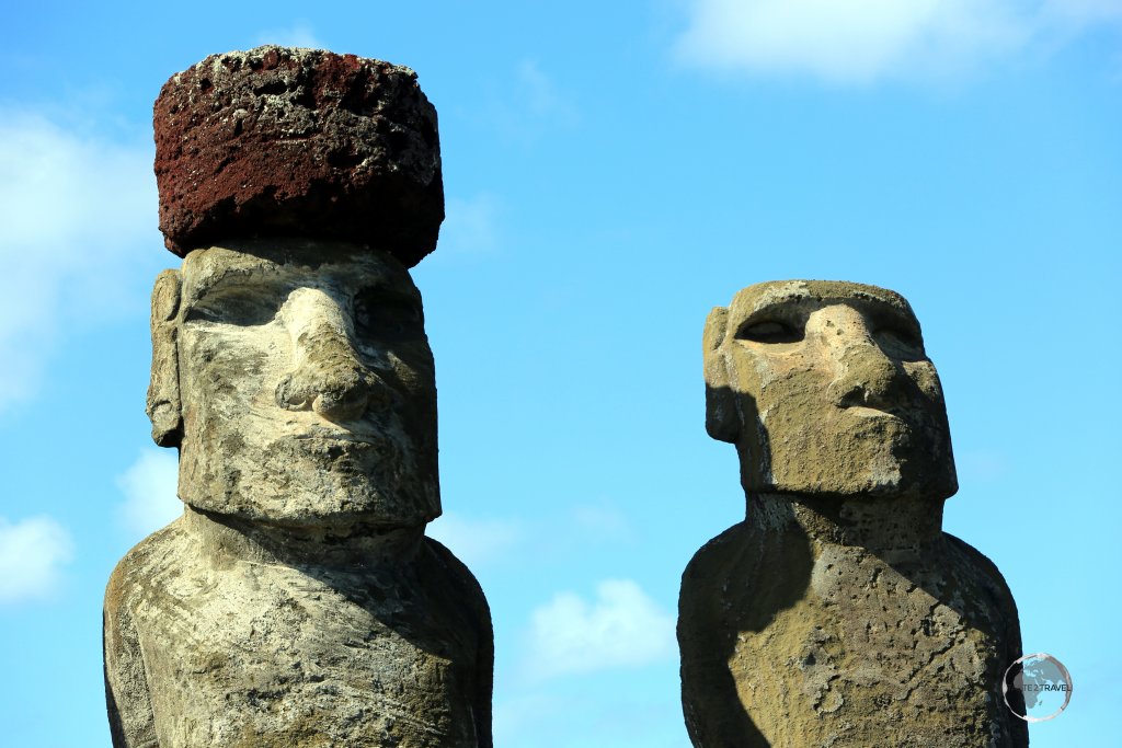 A moai at Ahu Tongariki wears a Pukao, a hat-like structure, or topknot, all of which were carved from a light-red volcanic scoria, which was quarried from a single source at Puna Pau.