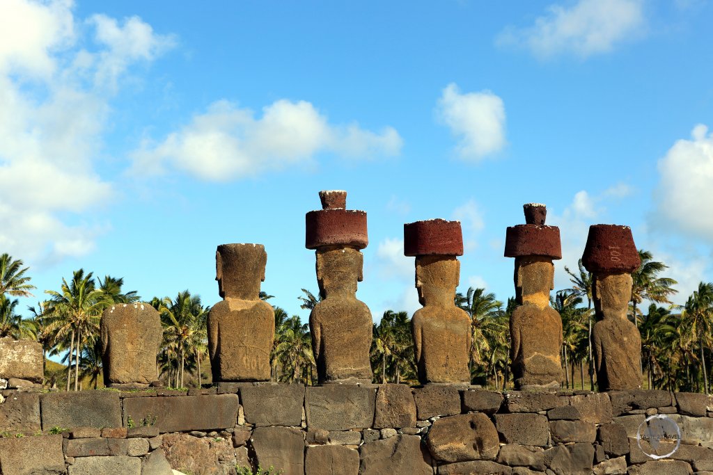 Overlooking Anakena beach, Ahu Nau Nau features four moai which are crowned with red, volcanic pukao.