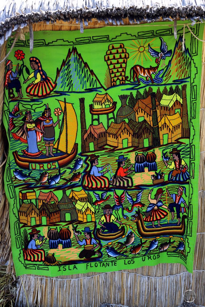 A souvenir wall hanging offers a colourful representation of life on the Uros Islands, a highlight of Lake Titicaca.