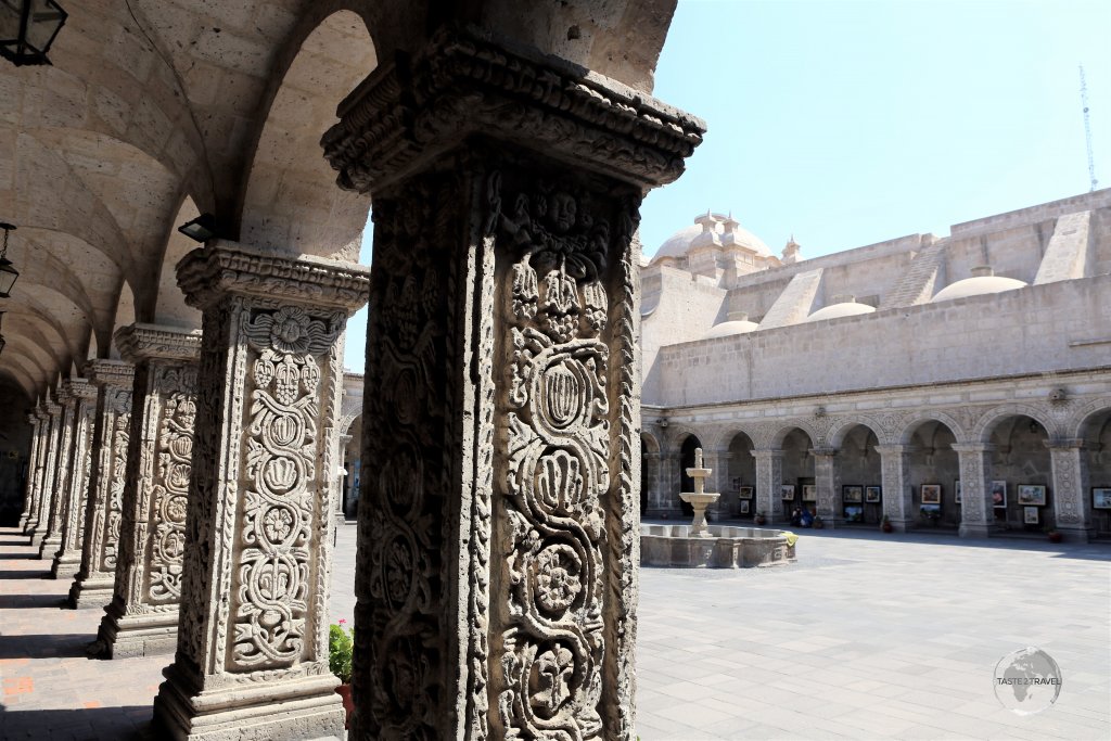 Decorative, white Sillar (volcanic rock), columns line the courtyard of the Jesuit 'Iglesia de la Compania de Jesus' (Company of Jesus church) in Arequipa, Peru