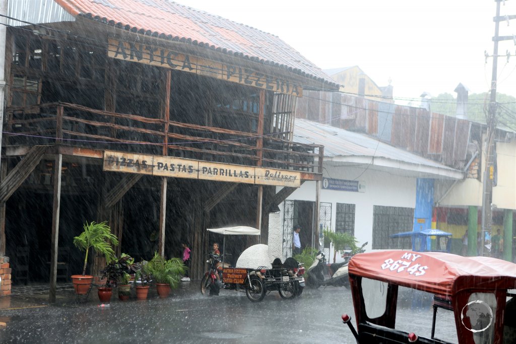 The daily afternoon downpour in Iquitos, the largest metropolis in the Peruvian Amazon with a population of 377,000 which has no road connection to the outside world.