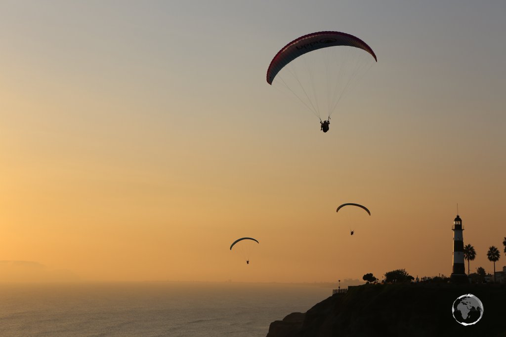 Paragliders over the Pacific Ocean at sunset, in Miraflores, an upscale neighbourhood of Lima, the capital of Peru.