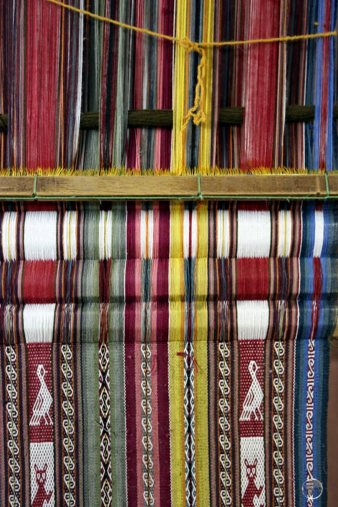 Andean weaving, seen here at Chinchero, is rich with innumerable Quechua symbols, patterns and animals.