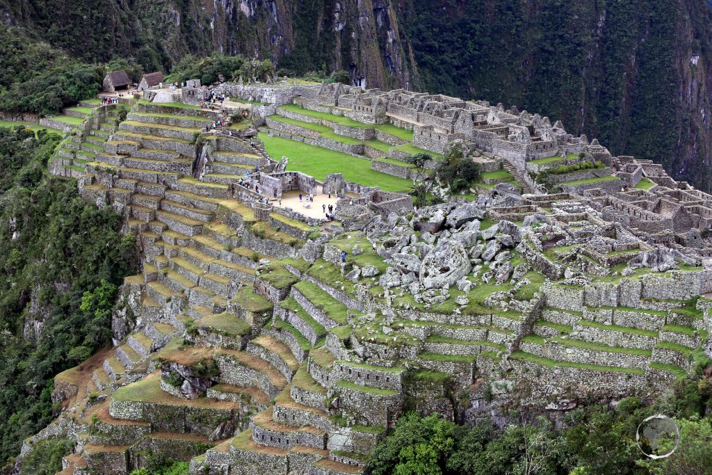 A view of Machu Picchu, a 15th-century Inca citadel, located in the Eastern Cordillera of southern Peru, on a 2,430-metre (7,970 ft) mountain ridge.