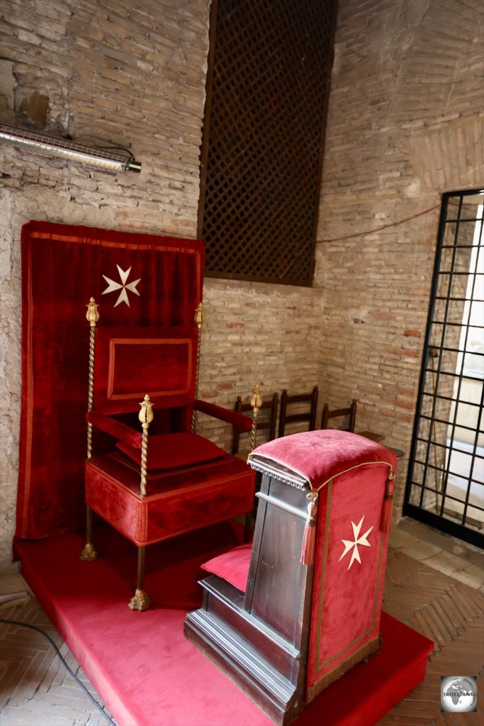 A Magistral Throne inside the Hall of the Loggetta at the Casa dei Cavalieri di Rodi.