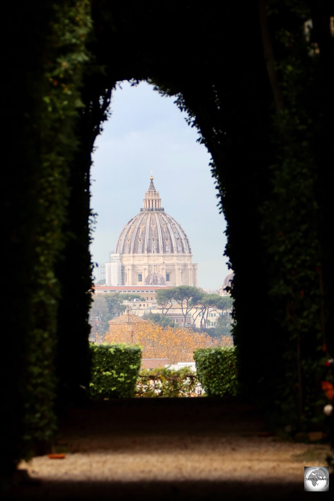 The view of St. Peters Basilica through the Cypress-hedge tunnel, taken from the garden.