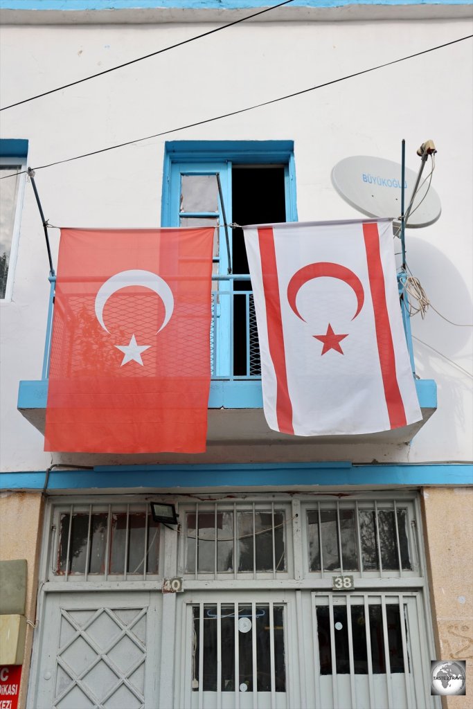 Hanging from the balcony of a house in North Nicosia, the flag of Turkey always flies alongside the flag of Northern Cyprus.