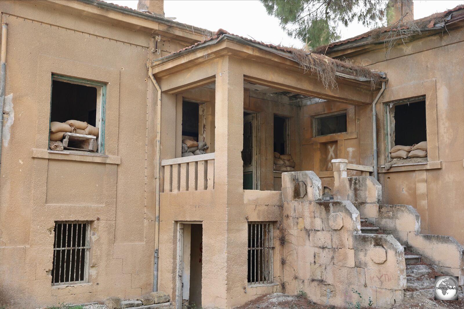 Frozen in time, an abandoned building inside 'no-mans-land' still bears the scars of battle.