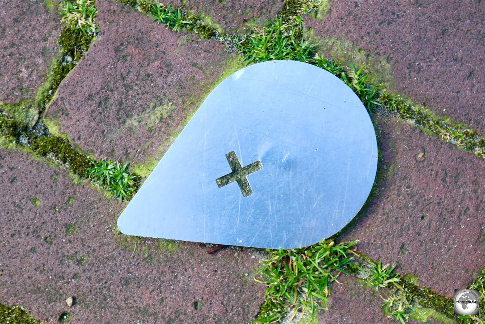 Markers on the ground indicate the route of the walking tour in Baarle.