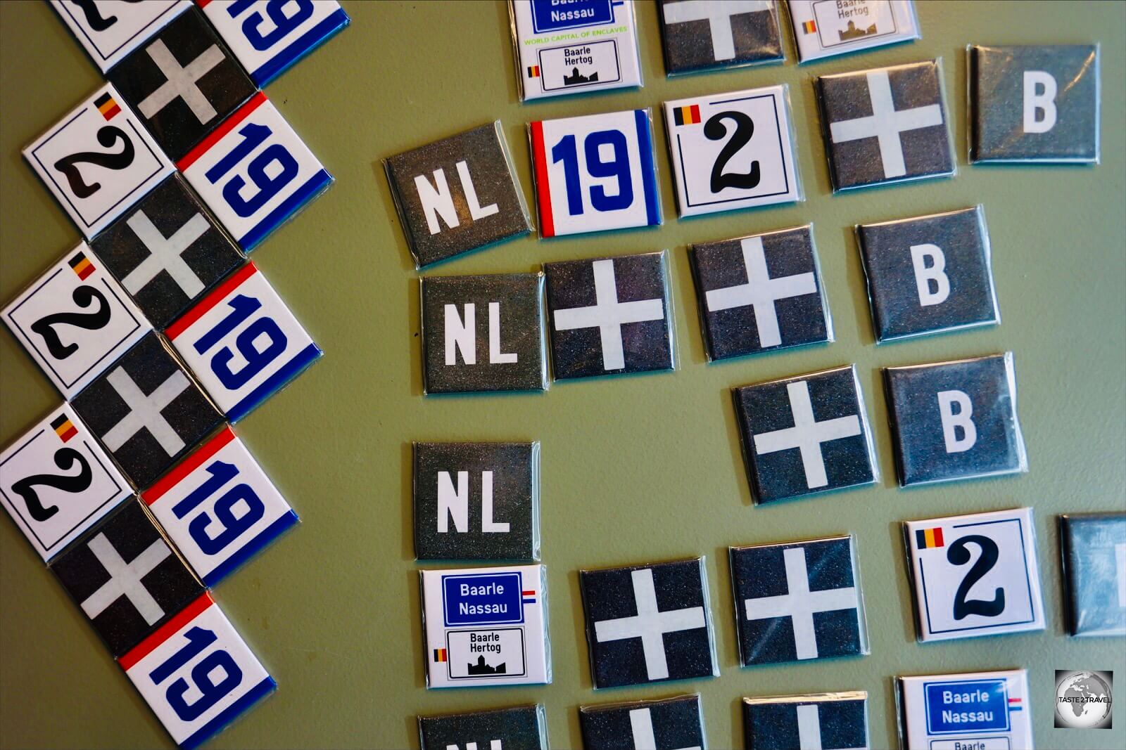 Souvenir magnets at the Baarle tourist office feature common sights seen in Baarle, from border markers to house numbers.