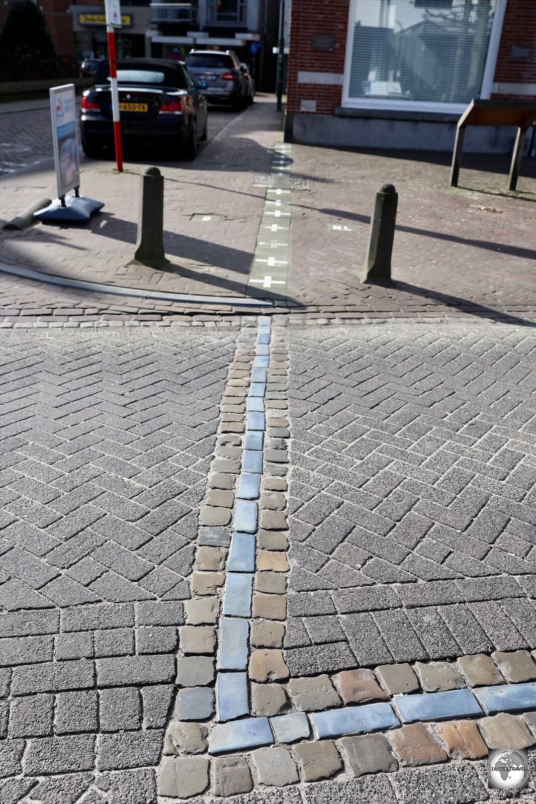 A line on the road in downtown Baarle indicates the meandering border line.