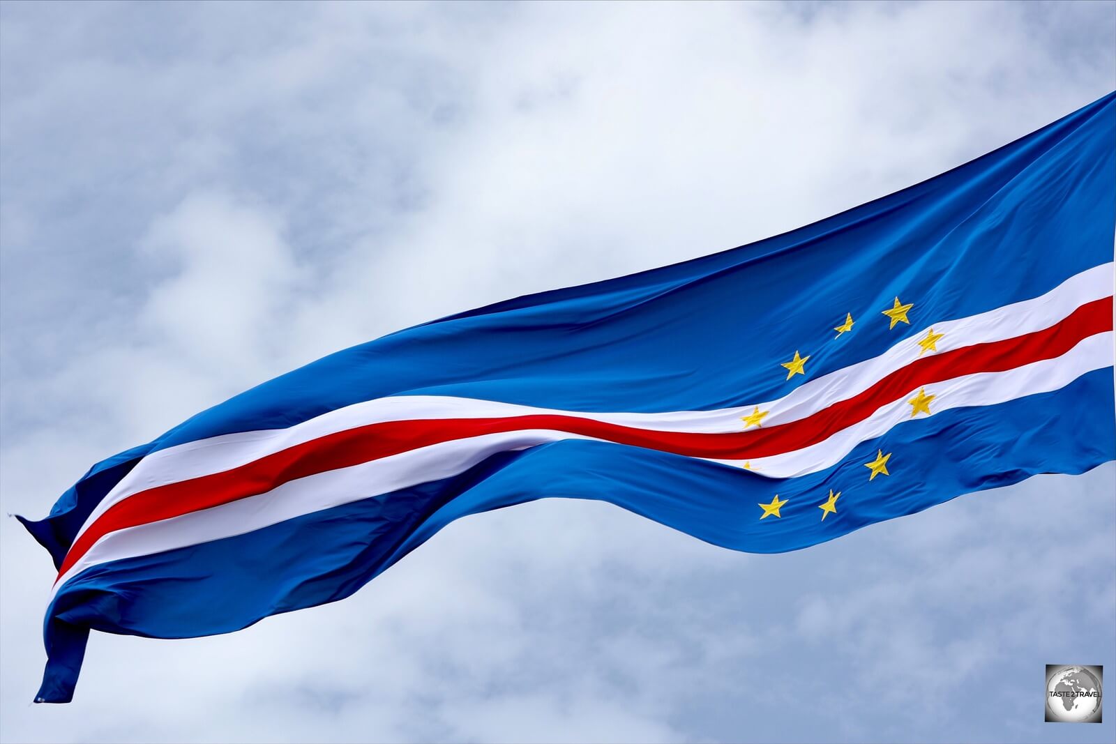 A very elongated version of the Cape Verde flag, flying outside the presidential palace in Praia.