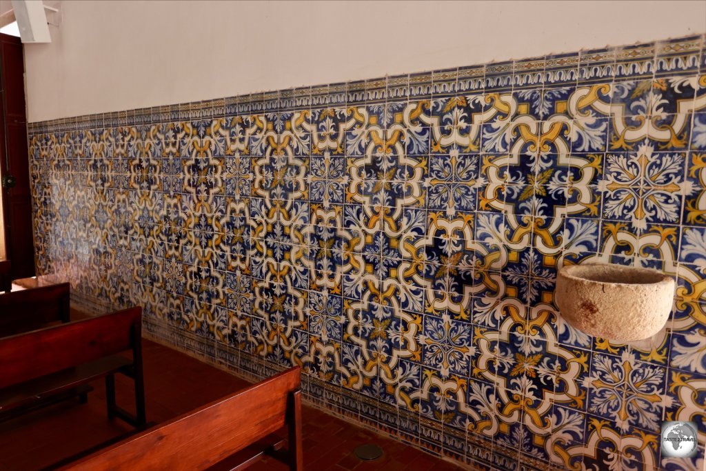 The interior of Nossa Senhora do Rosario church features Portuguese tiles, known as Azulejos.