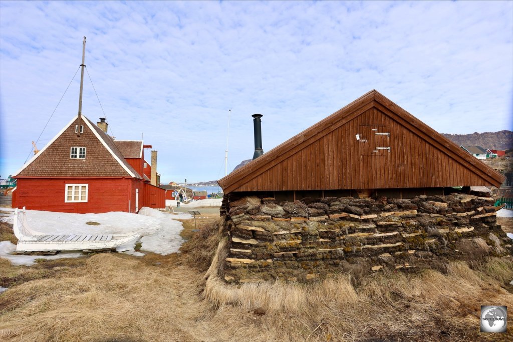 A turf house and other buildings which form the Sisimiut Museum complex.
