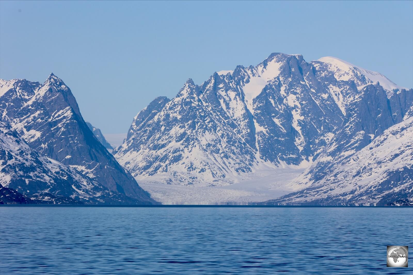 In the distance, a huge glacier drains into the sea, a typical sight on the coast of Greenland.