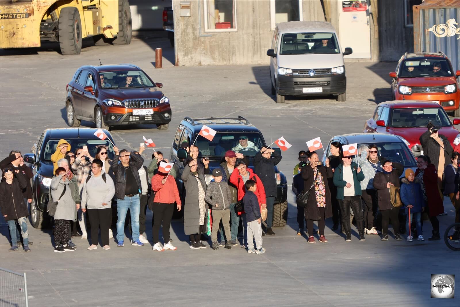 At each port, such as Maniitsoq, crowds of family and friends gather to greet and farewell loved ones.