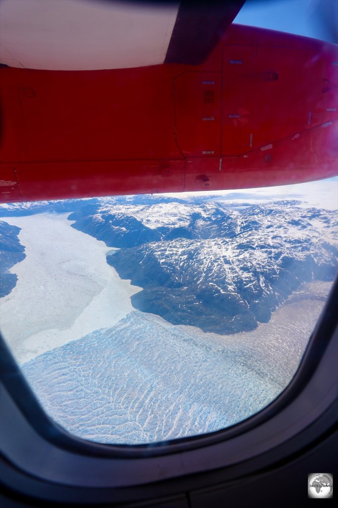 A view of a glacier and the Greenland Ice Sheet from an Air Greenland flight.
