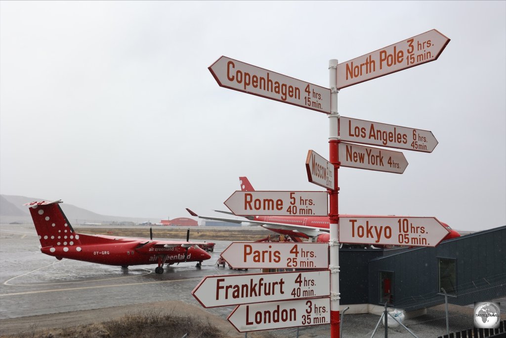 A distance sign at Kangerlussuaq Airport.