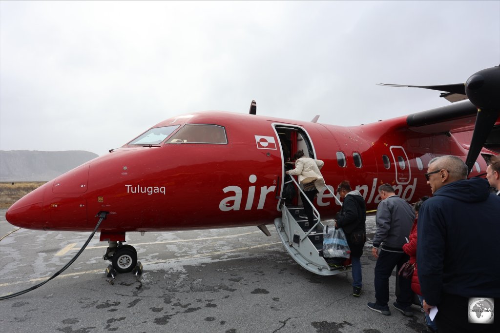 Boarding an Air Greenland Dash-8 plane at Kangerlussuaq Airport.